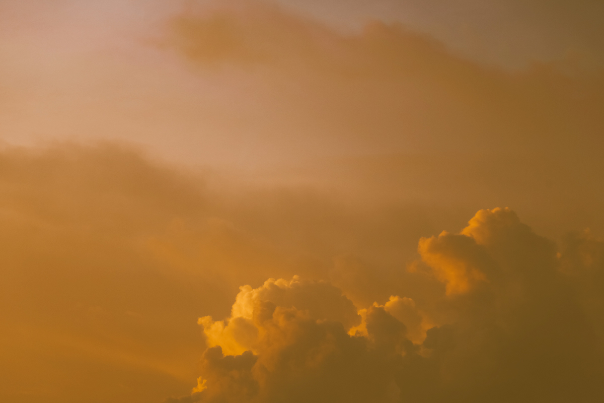Image of clouds with a yellow haze