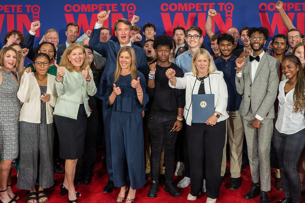 Image of Governor Youngkin and the First Lady cheering with a group