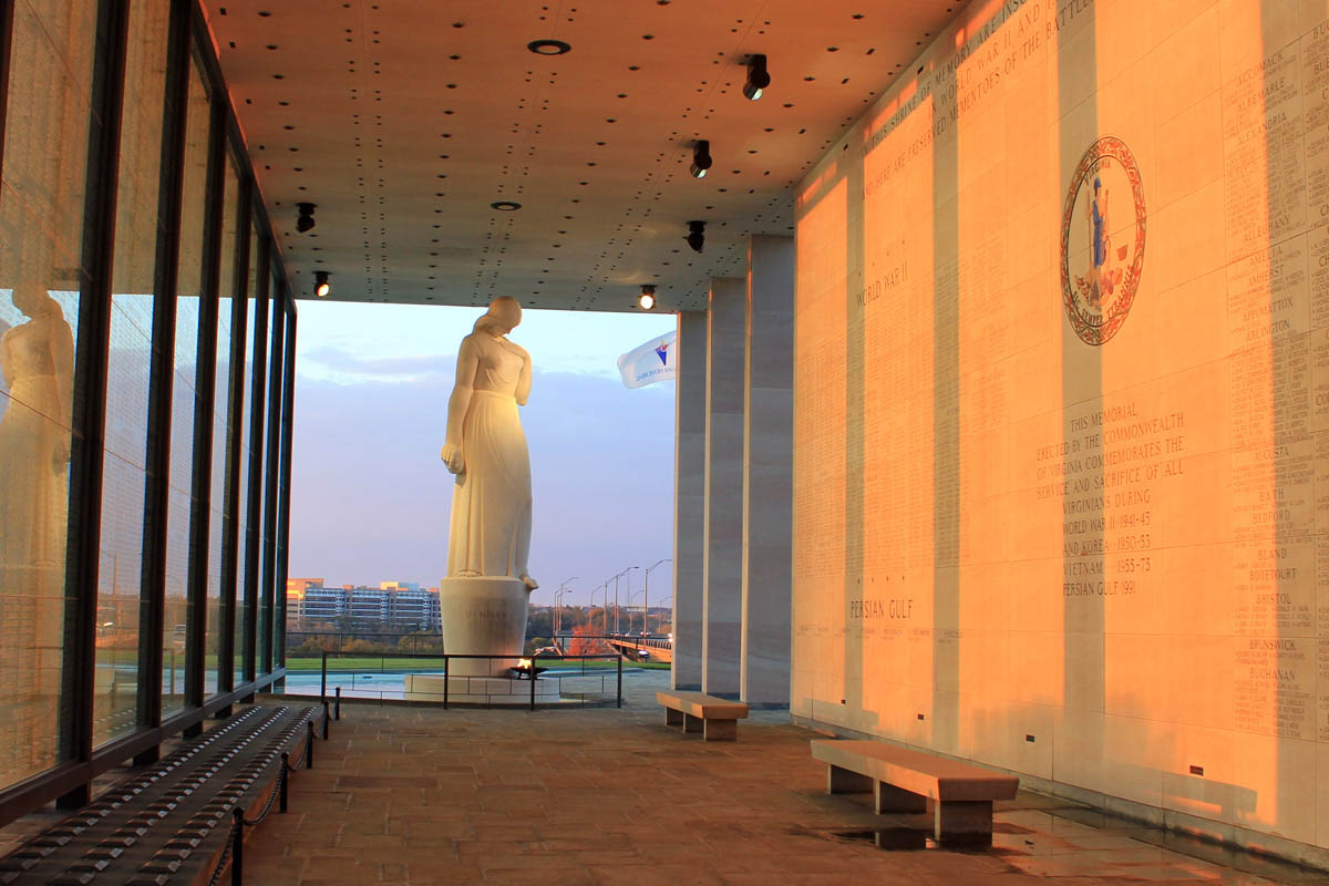 The statue Memory is at the end of the wall of names of fallen Virginia soldiers