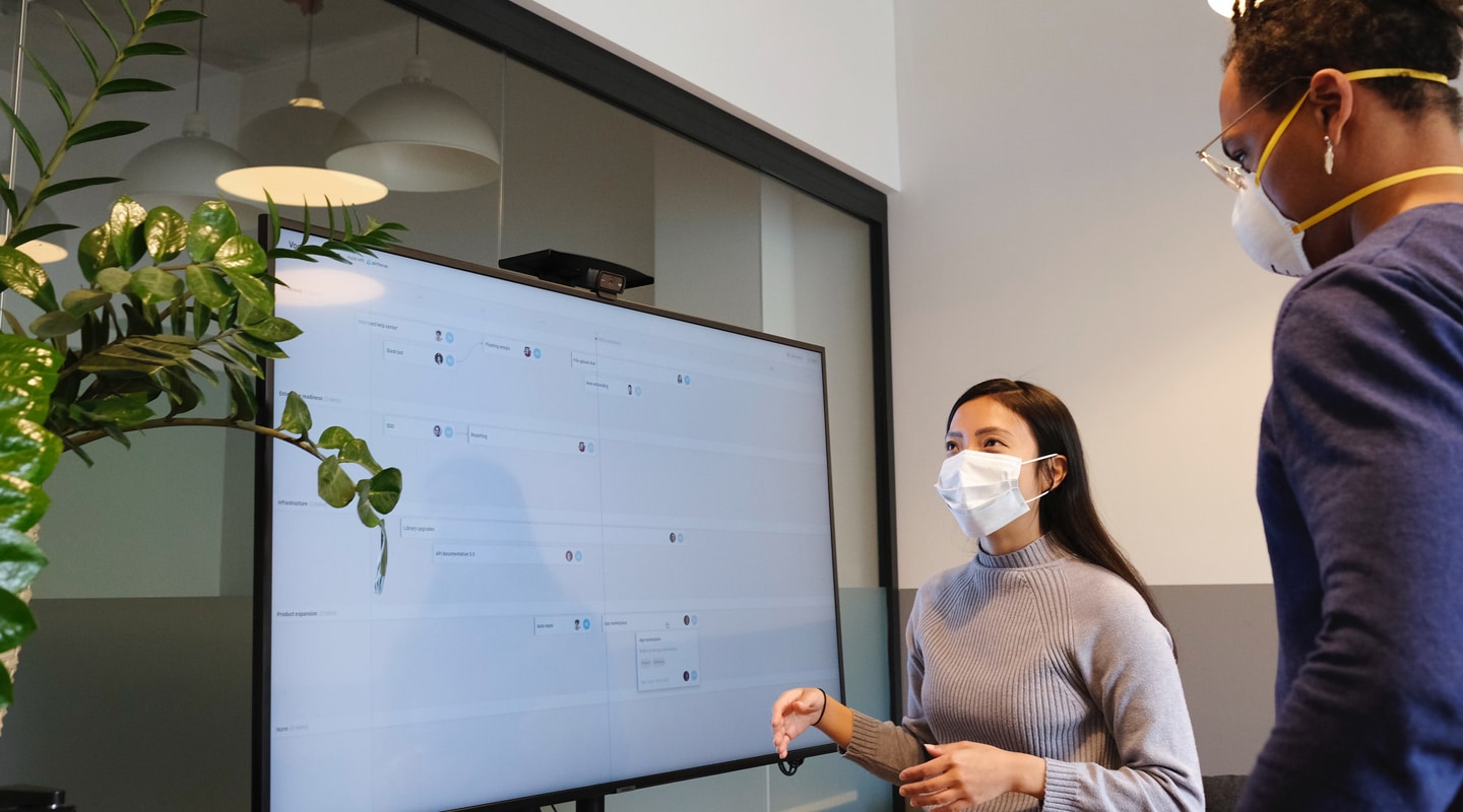 Workers in the office wearing face masks