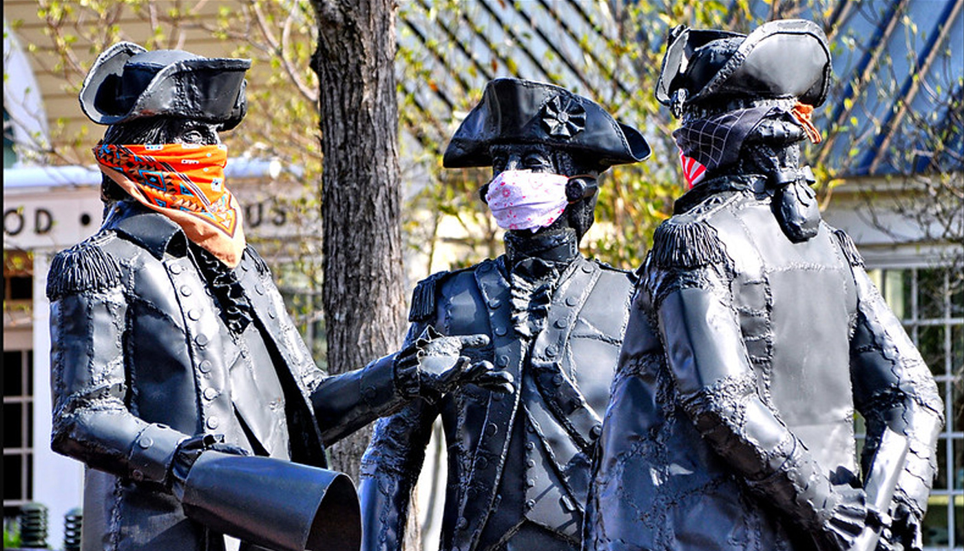statues of revoluntary era men in face masks