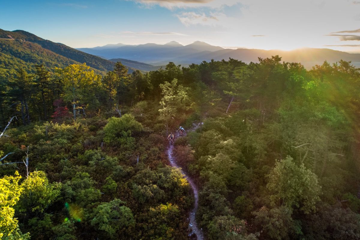 scenic view from mountain over valley with stream